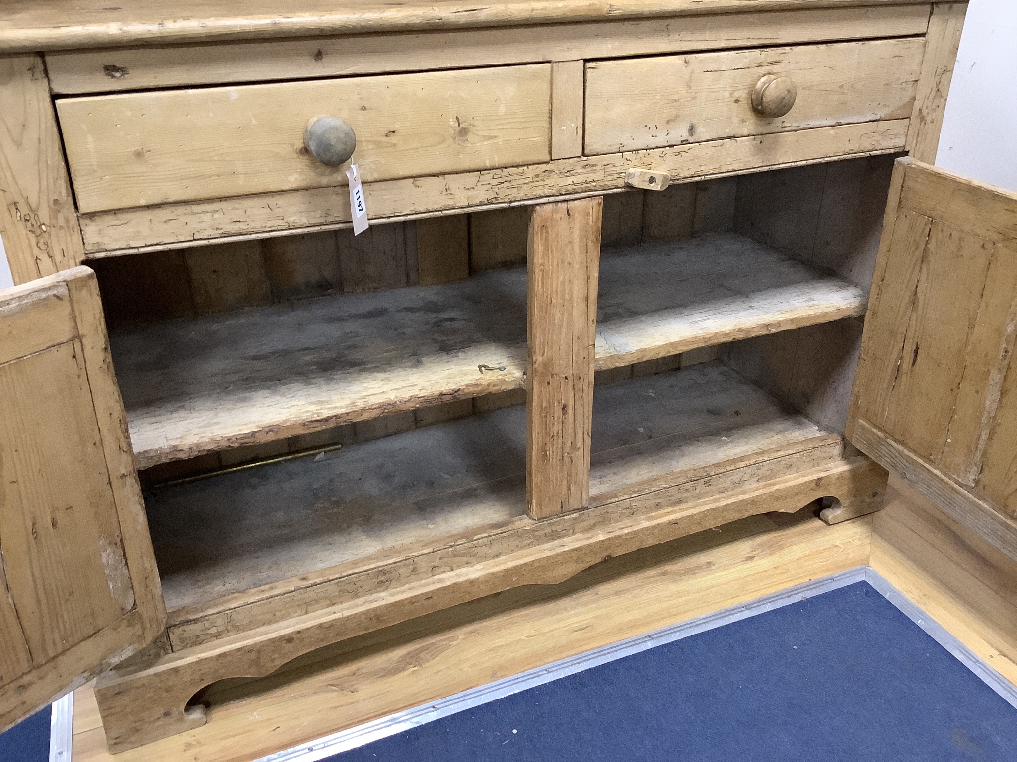 An early 19th century Irish pine dresser, length 122cm, depth 45cm, height 202cm